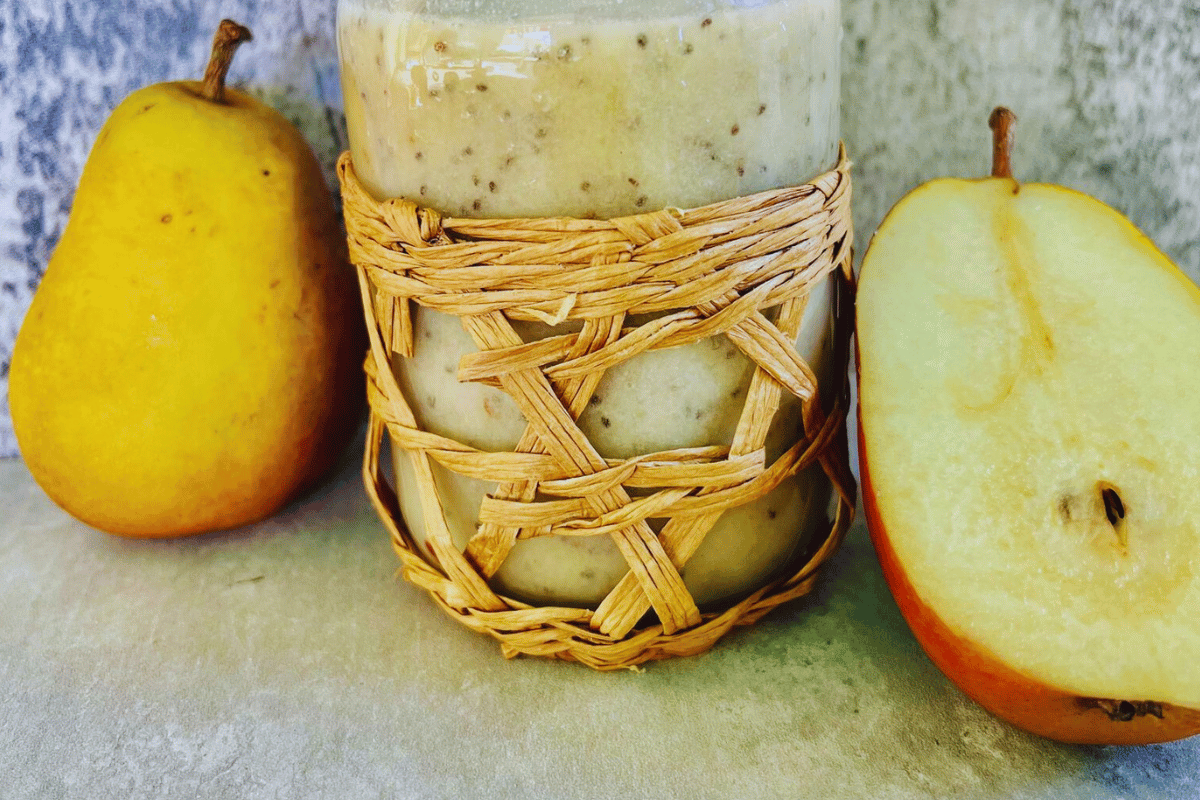 Pear Smoothie For Weight Loss surrounded by sliced pears