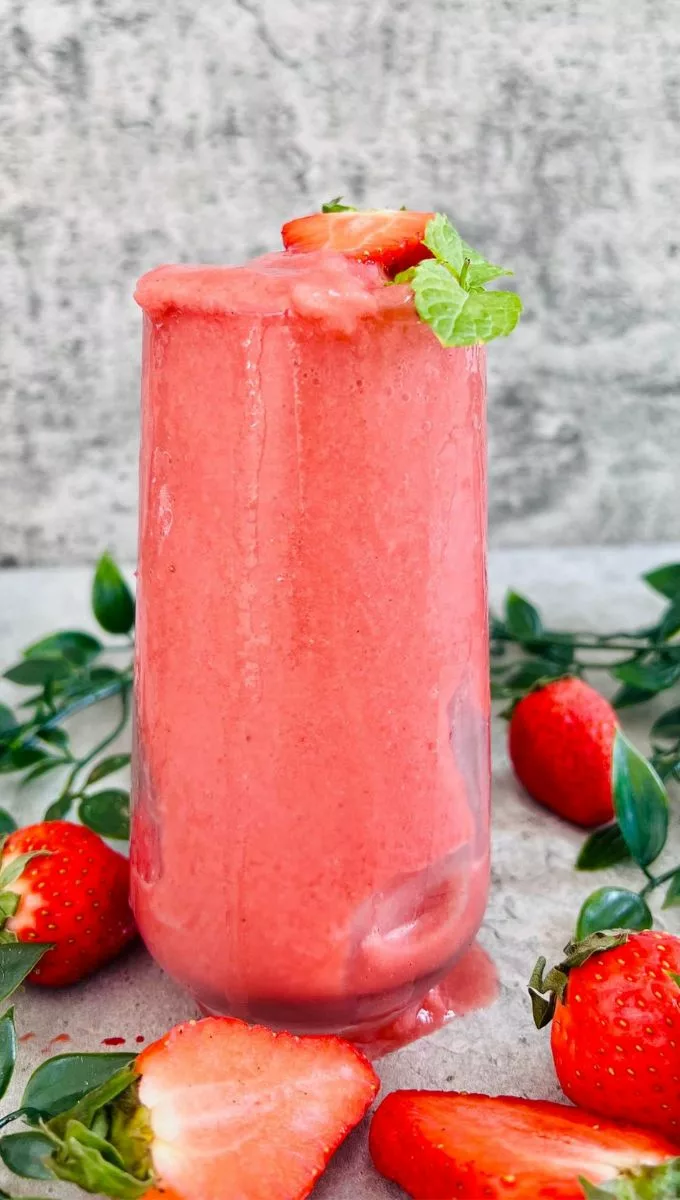 Strawberry Mint Smoothie served in a tall glass cup