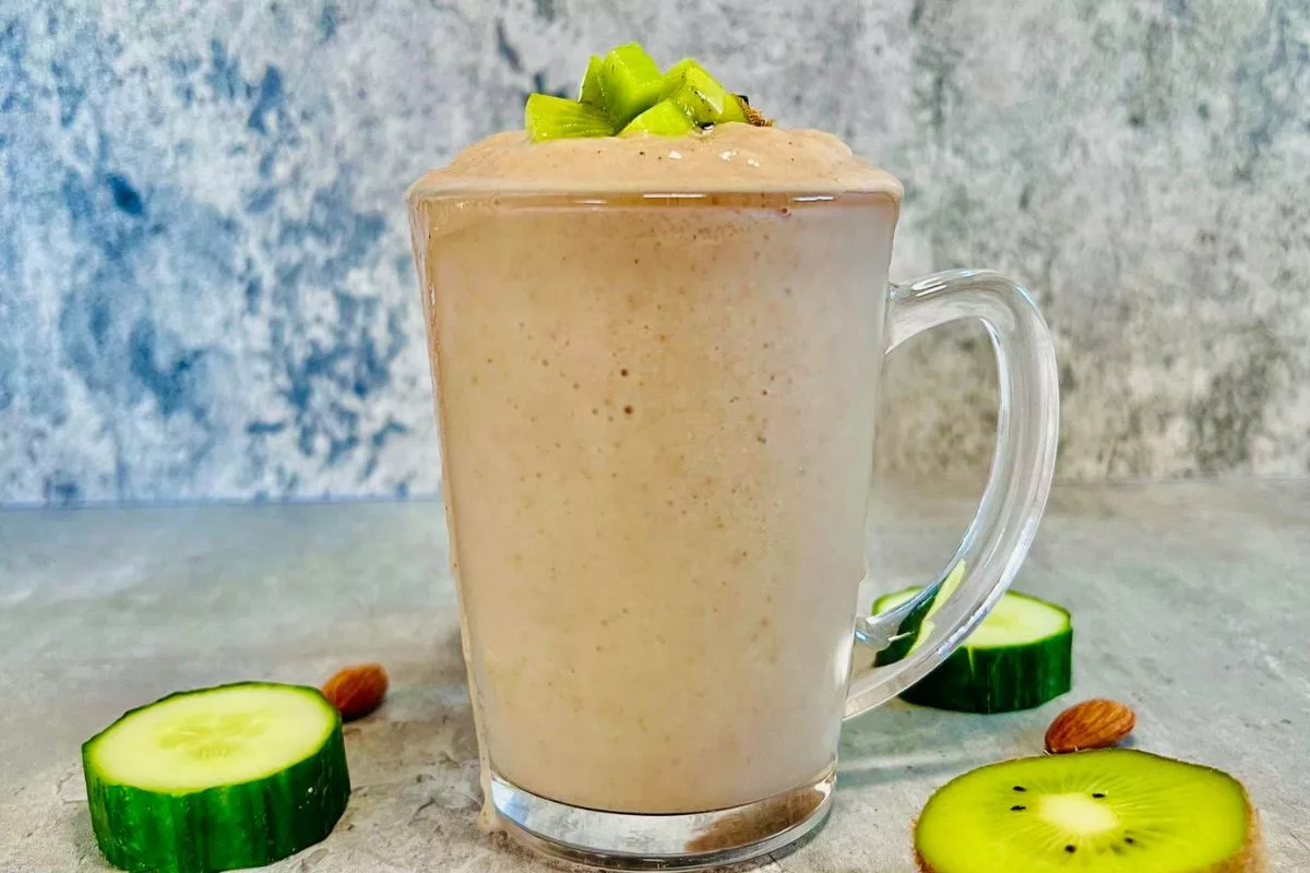 kiwi and cucumber smoothie made low fodmap served in a tall glass cup