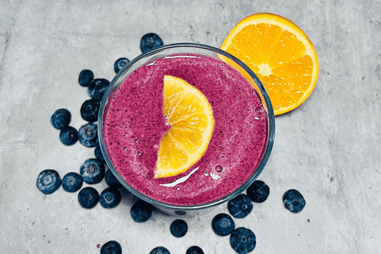 blueberry-smoothie-topped-with-a-fresh-sliced-orange