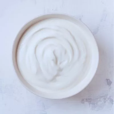 creamy yogurt in a ceramic bowl