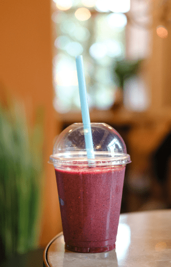 berry smoothie in a plastic cup