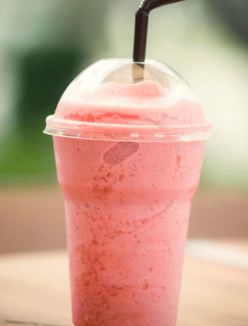 strawberry smoothie in a plastic cup