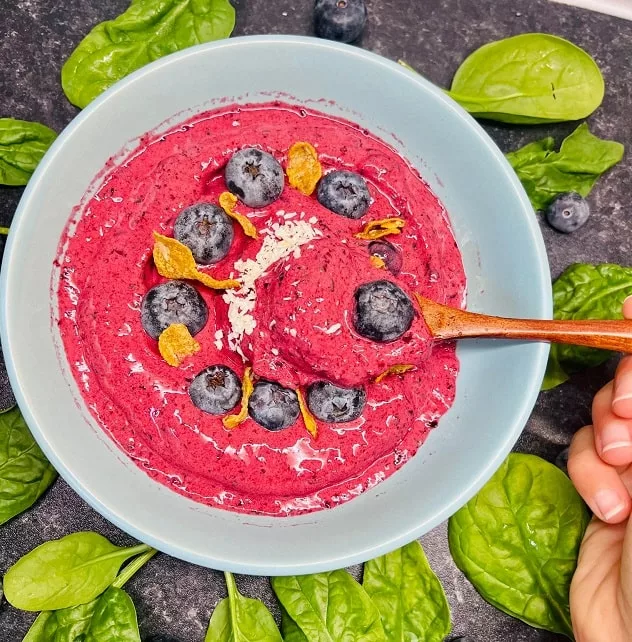 spoonful of a blueberry smoothie bowl