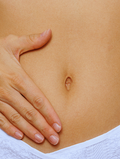 woman touching her stomach