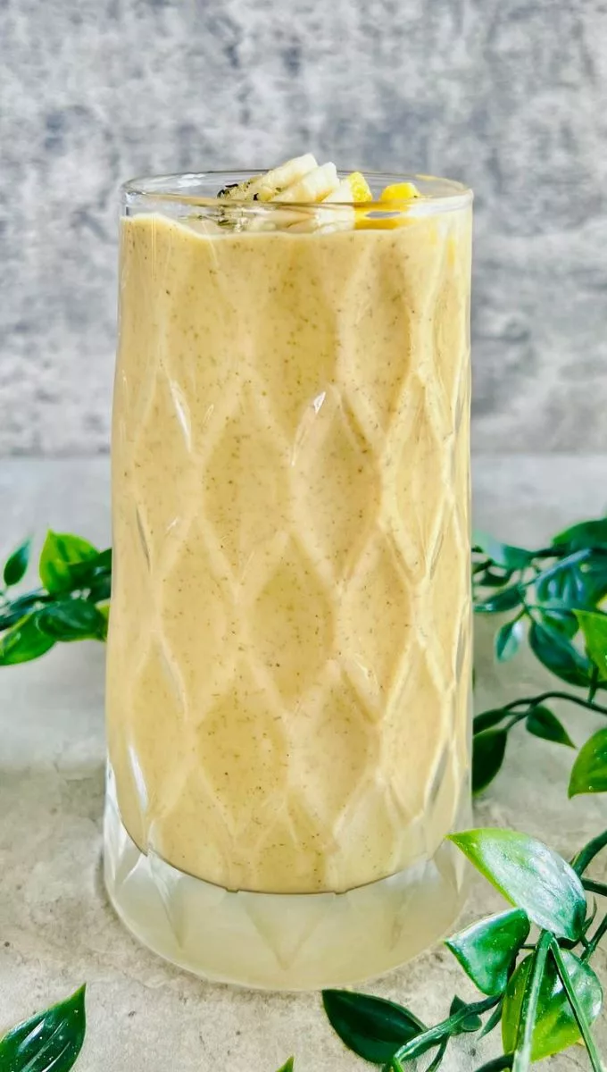 Mango Coconut Smoothie served in a tall glass cup