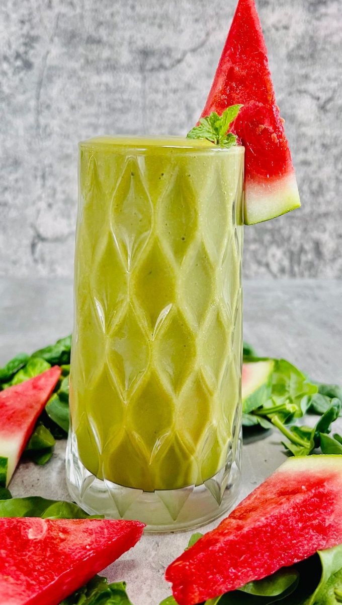 Watermelon Green Smoothie served in a talll thick glass cup