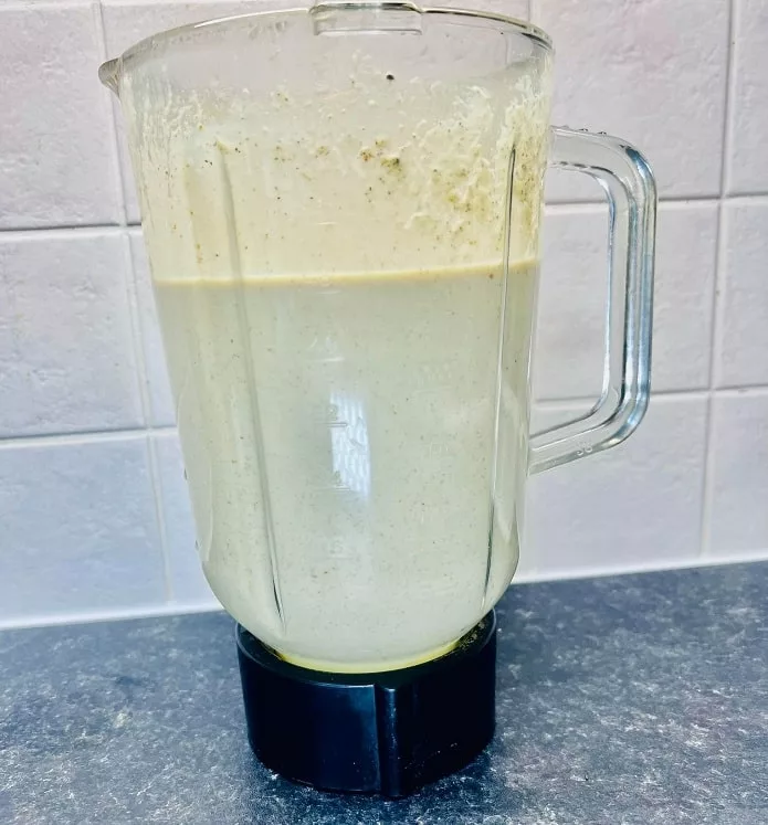 Blender filled with high calorie protein shake