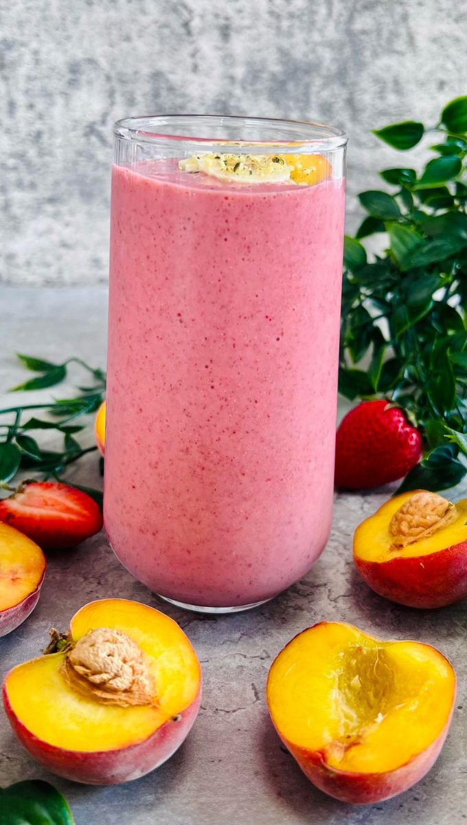 Peach Smoothie Recipe Without Yogurt served in a tall thin glass cup