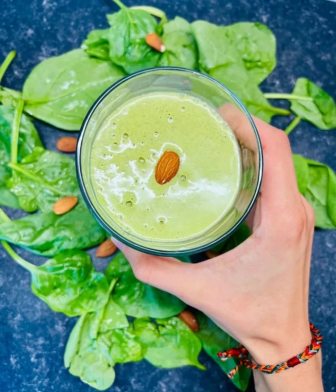 a hand holding a smoothie made without fruit