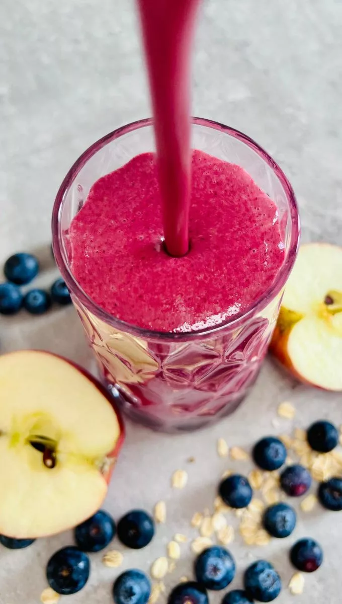 Blueberry Apple Smoothie being poured into a glass cup