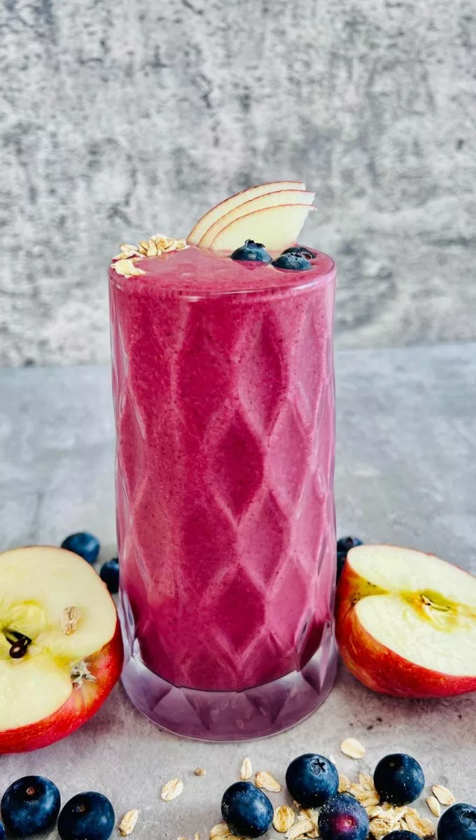 Blueberry Apple Smoothie served in a tall glass cup
