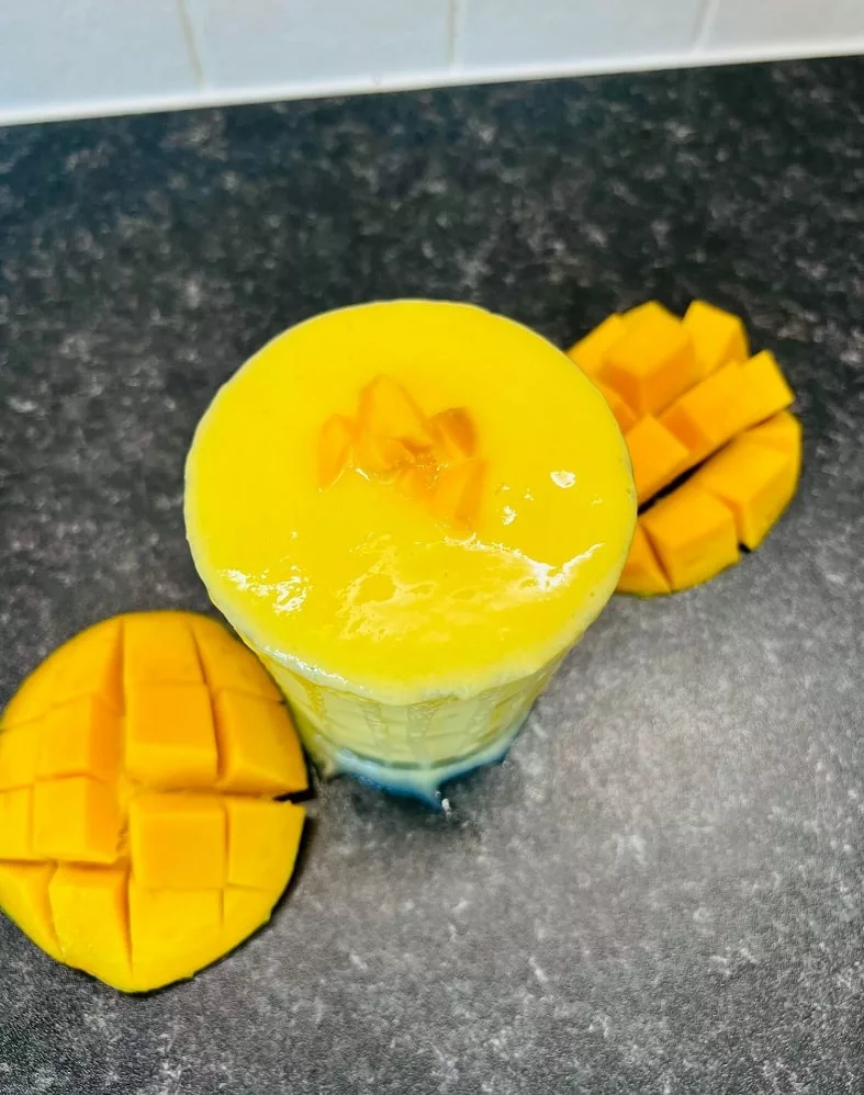 a blend of mango and pineapple drink