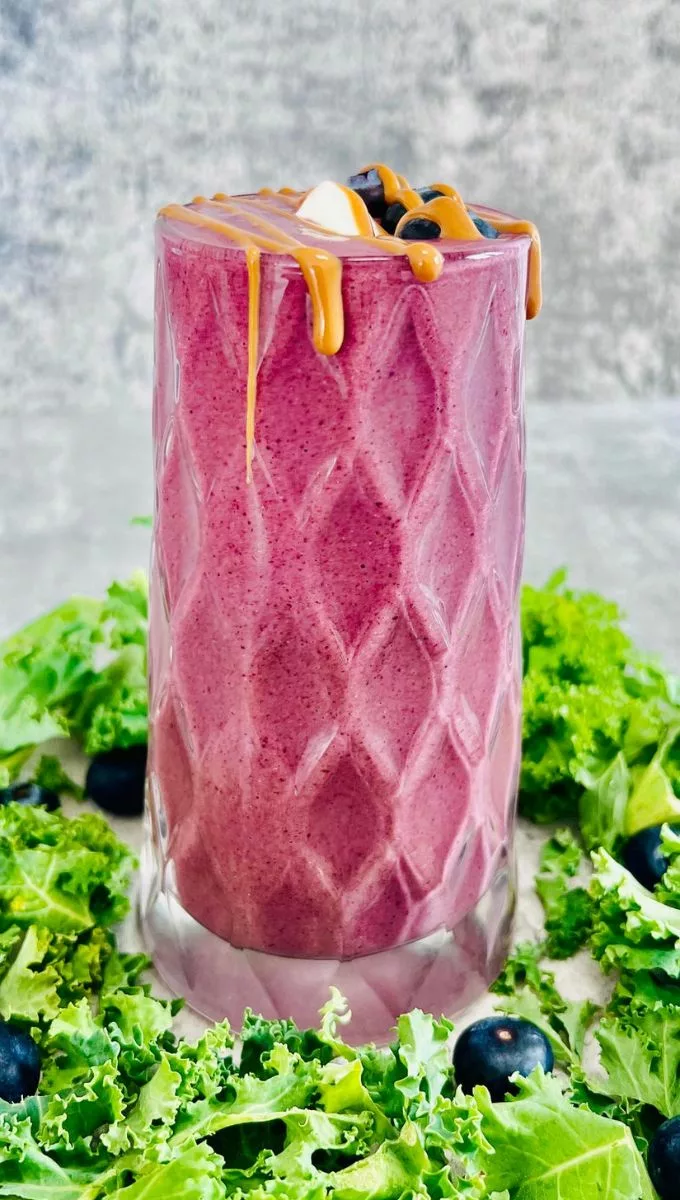 Kale Blueberry Kefir Smoothie served in a tall thick glass cup