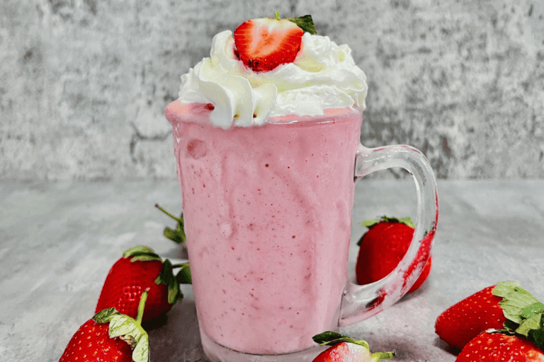 Strawberry Banana Smoothie With Ice Cream topped with whipped cream
