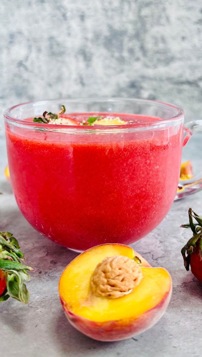 Strawberry Peach Smoothie served in a round glass cup