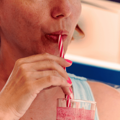 person drinking a smoothie