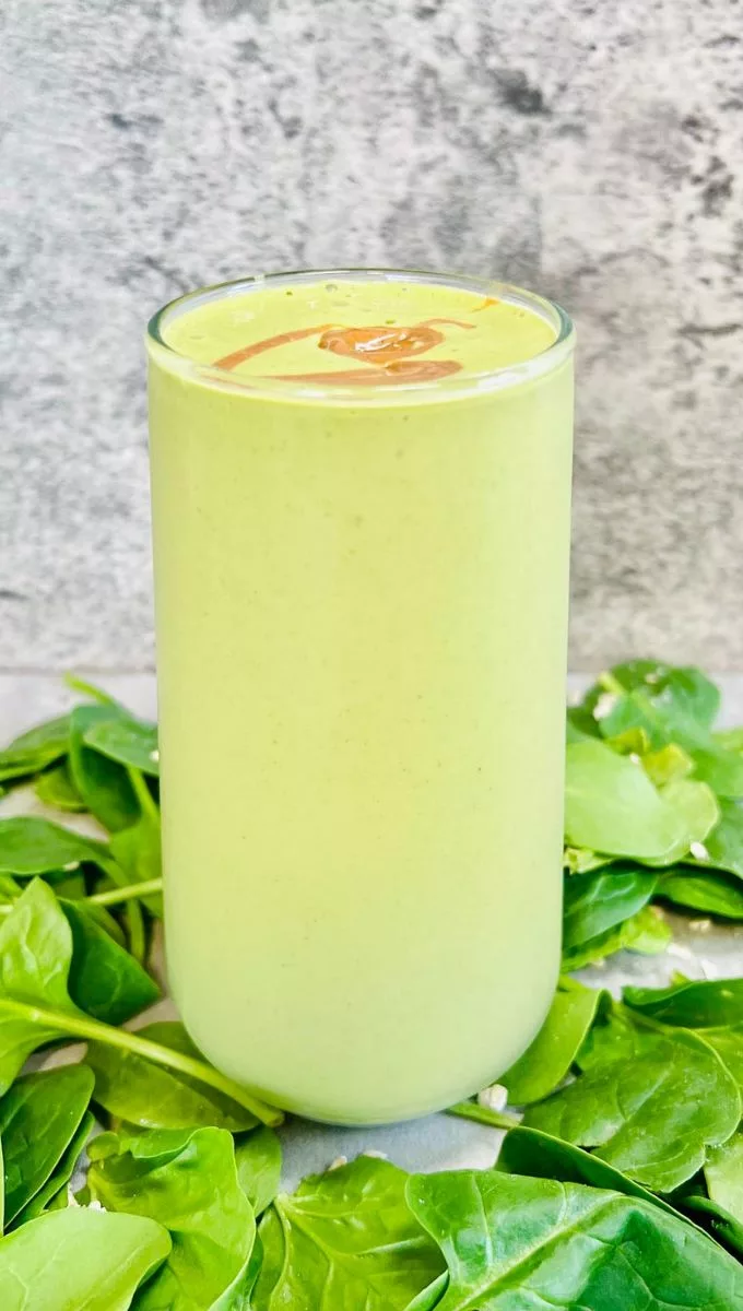 Spinach Peanut Butter Smoothie served in a tall glass cup