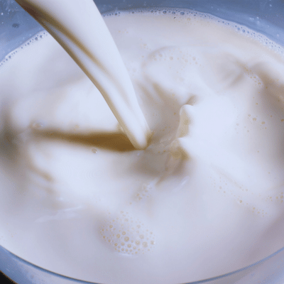milk being poured into a glass