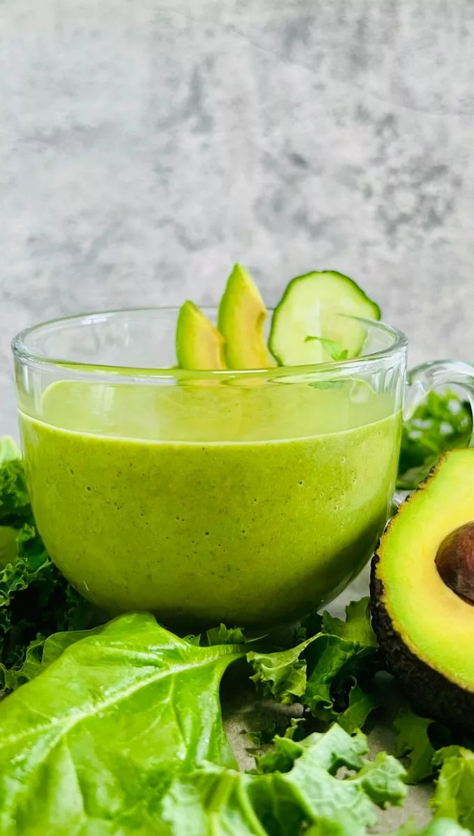 Green Raw Smoothie in a round glass cup