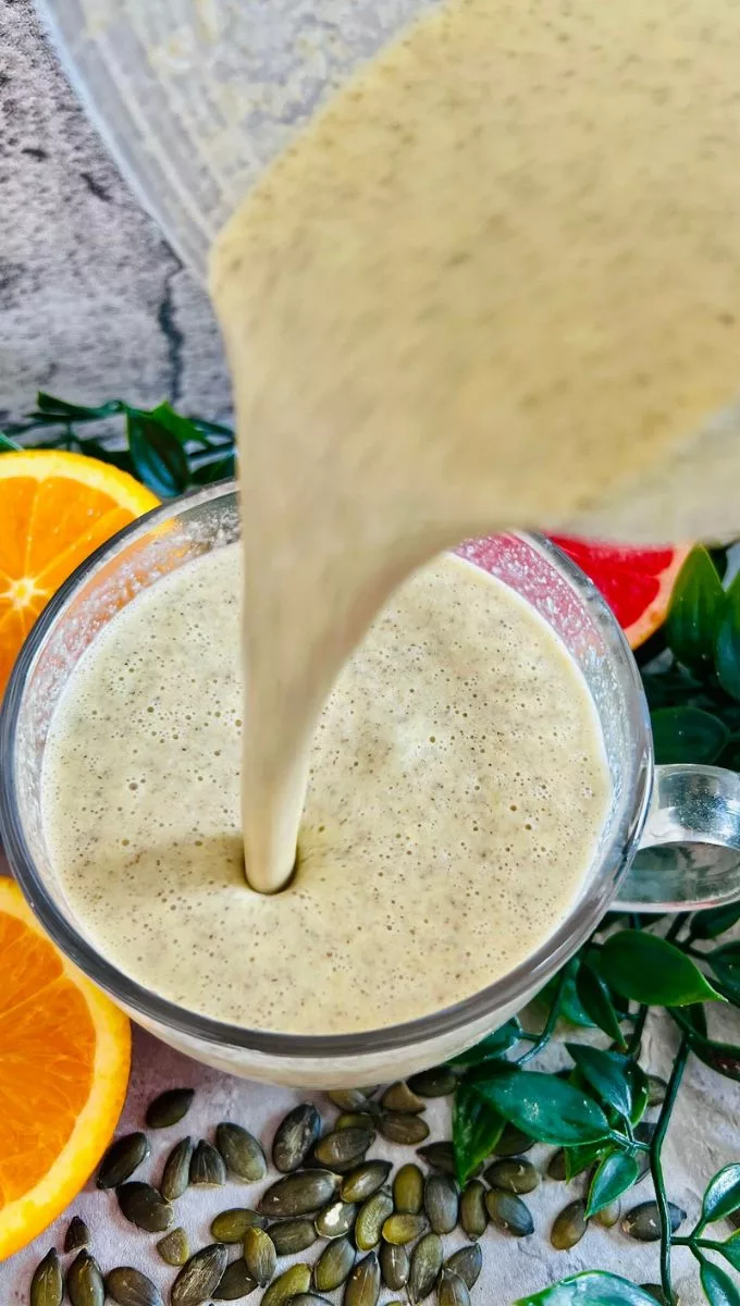 Smoothie Recipe To Lower Blood Pressure being poured into a round glass cup
