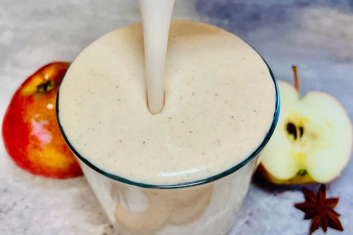 Apple Pie Protein Smoothie being poured into a glass cup
