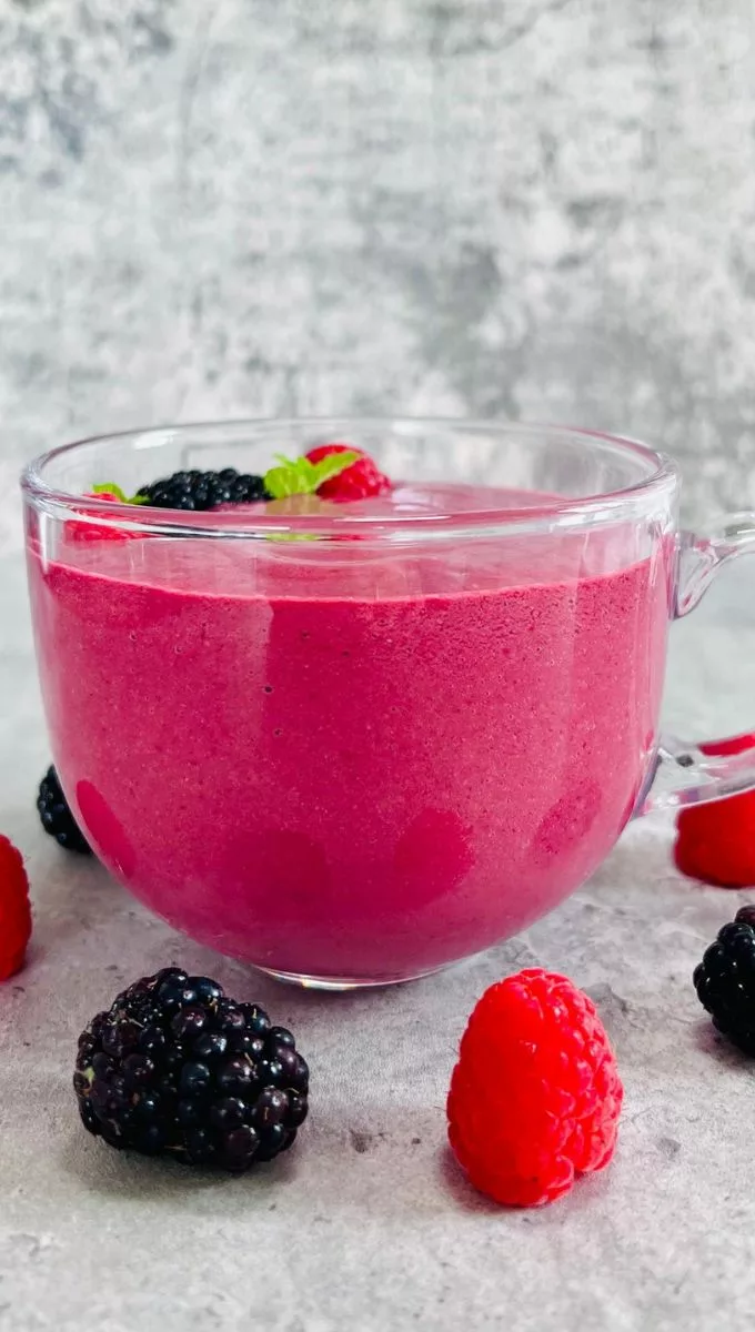 Raspberry Blackberry Smoothie served in a round glass cup