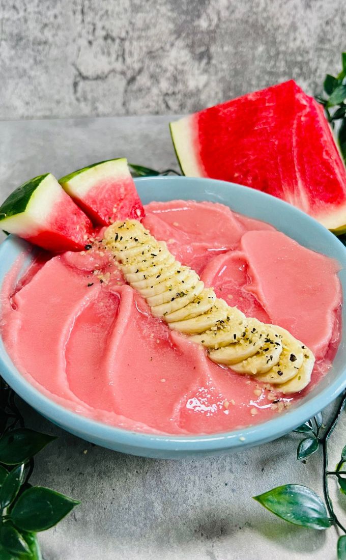 Watermelon Smoothie Bowl topped with sliced cucumber and banana slices