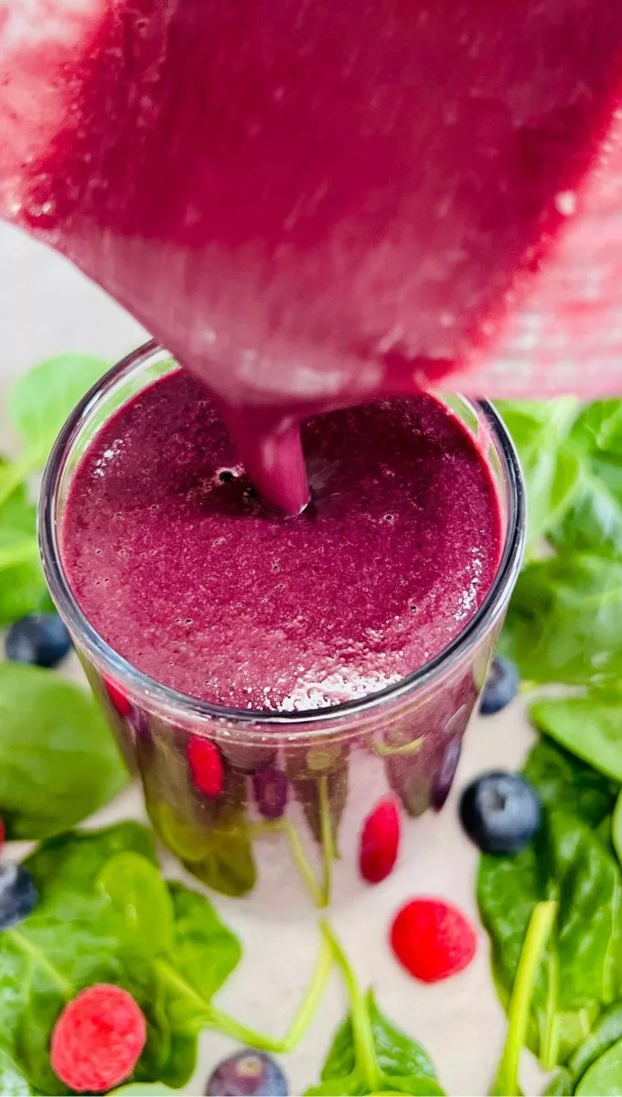 Cabbage Smoothie For Weight Loss being poured into a glass cup