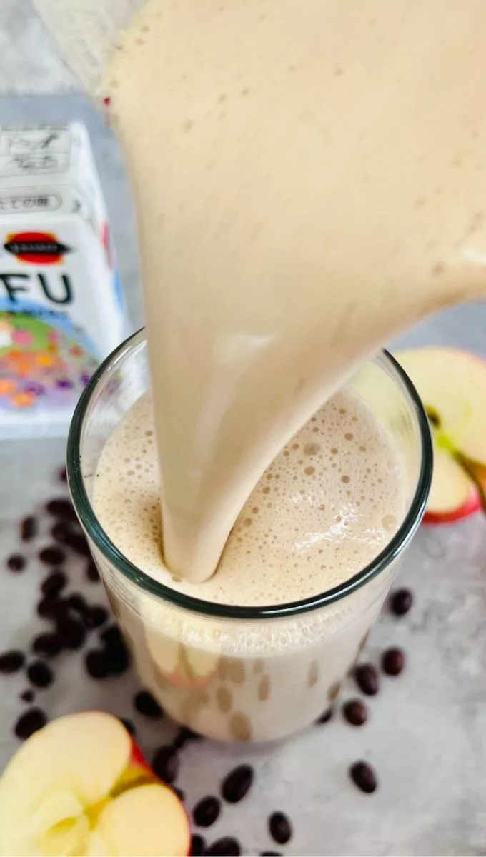 Coffee Tofu Smoothie being poured into a glass cuo