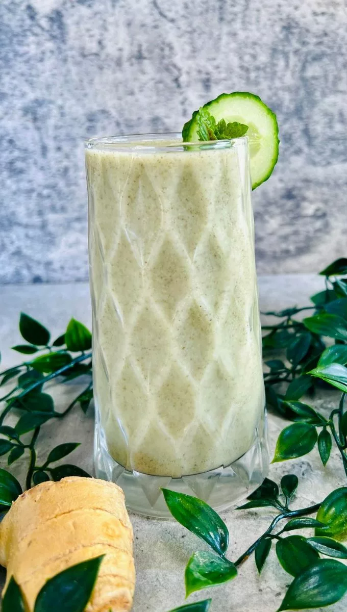 Ginger Pineapple Smoothie served in a tall thick glass cup