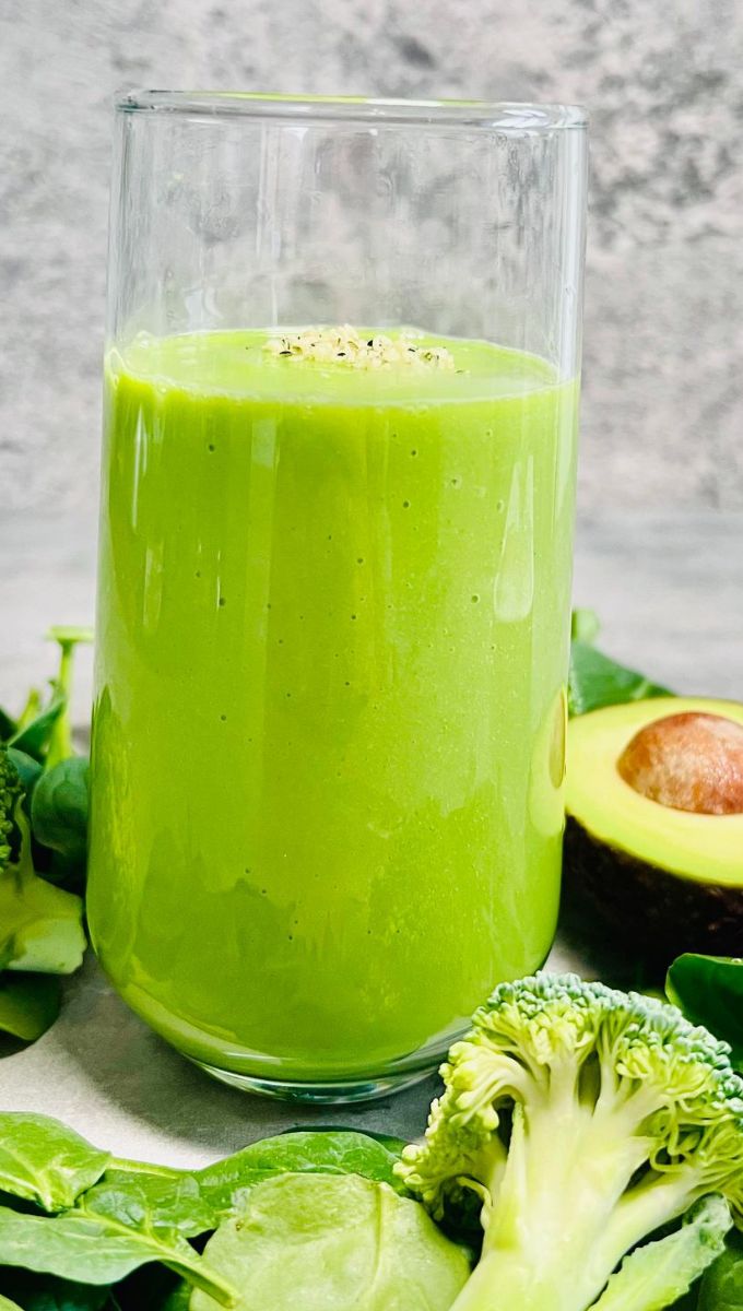 Green Broccoli Smoothie served in a tall thin glass cup