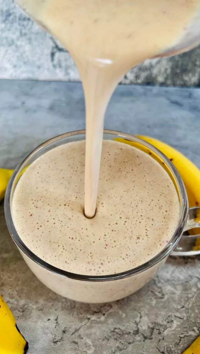 Tofu Banana Smoothie being poured into a glass cup