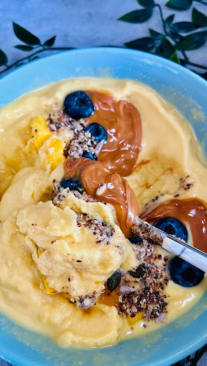 a spoonful of Mango Smoothie Bowl