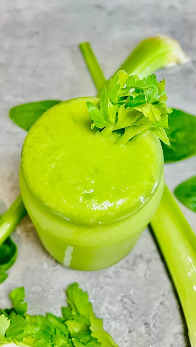 cleansing celery smoothie topped with fresh celery