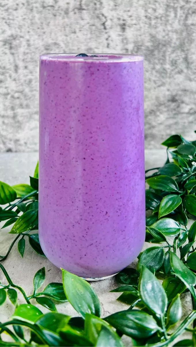 Blueberry Smoothie With Egg Whites Served In a Tall Glass Cup