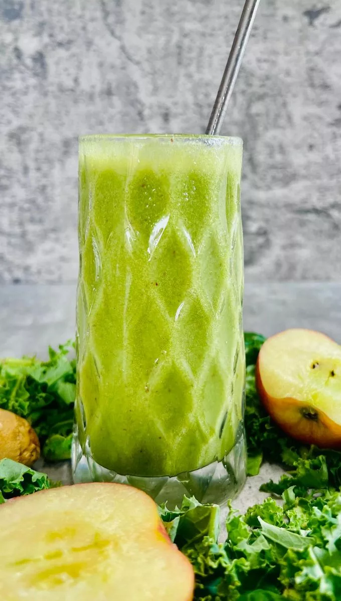 Kale Apple Smoothie served in a tall glass cup