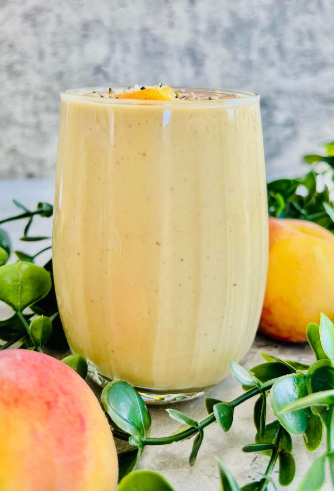 Peach Protein Smoothie served in a small glass cup